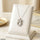 Stainless Steel Zircon Bow/Round Pendant